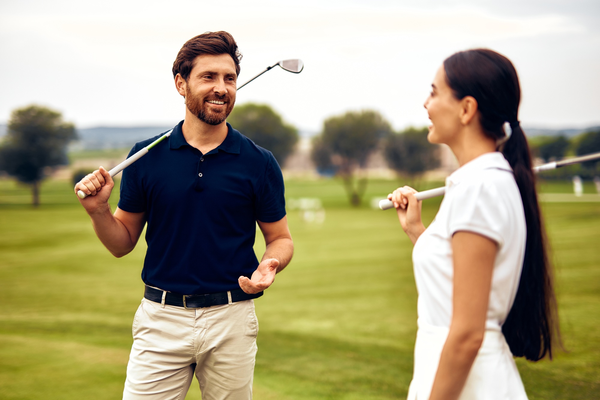 A Playful Couple Delightfully Enjoying a Wonderful Day on the Beautiful Golf Course