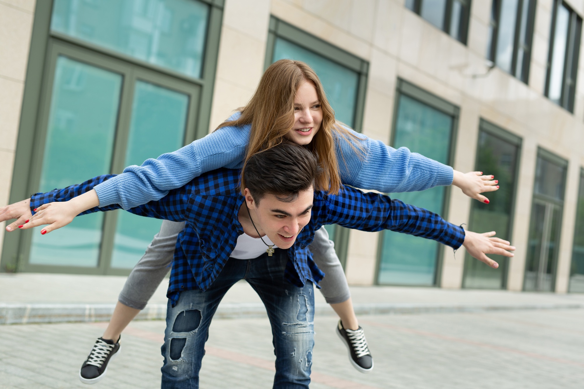 Freedom and fun, emotions and feelings. A cheerful and playful couple is fooling around