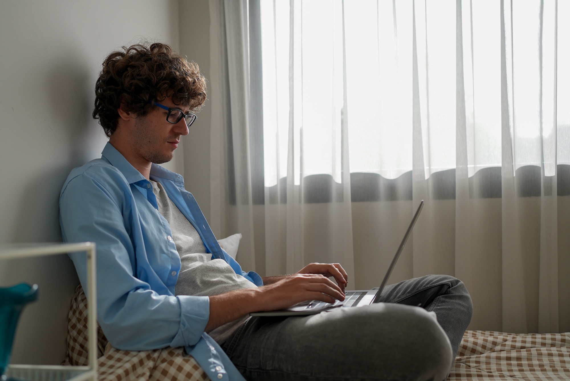 Happy businessman using laptop sending email working at home