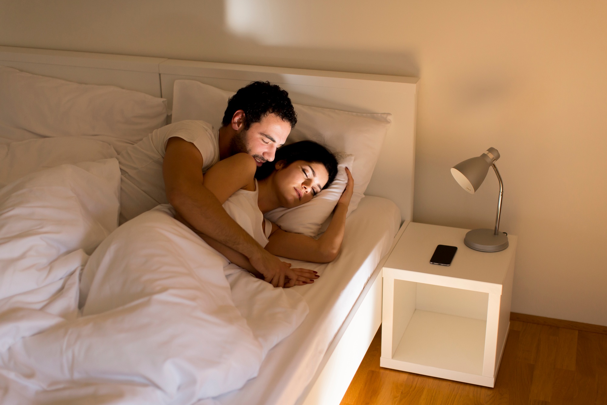 Loving couple on bed