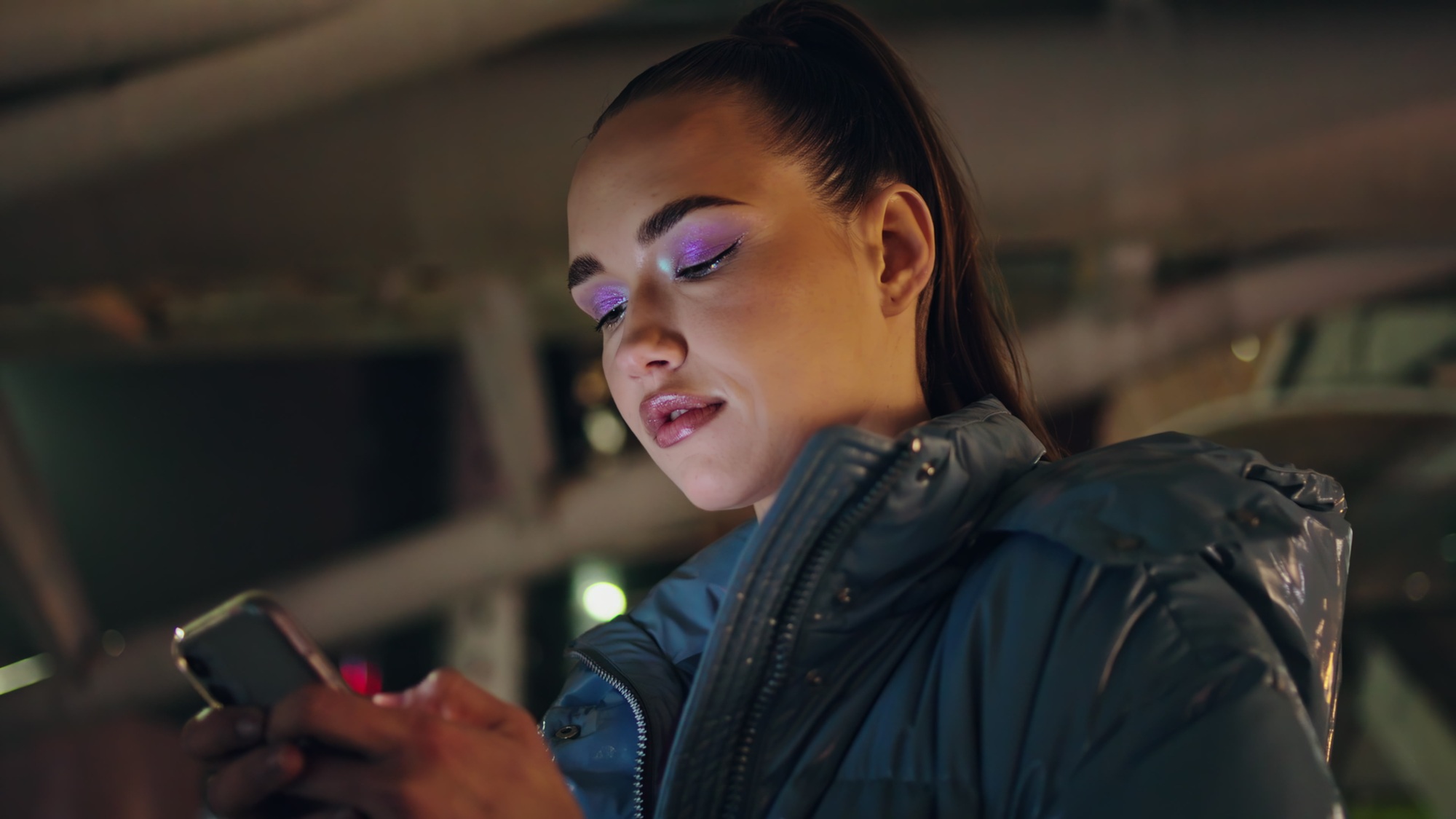 Serious girl writing sms on smartphone evening time close up. Woman texting.