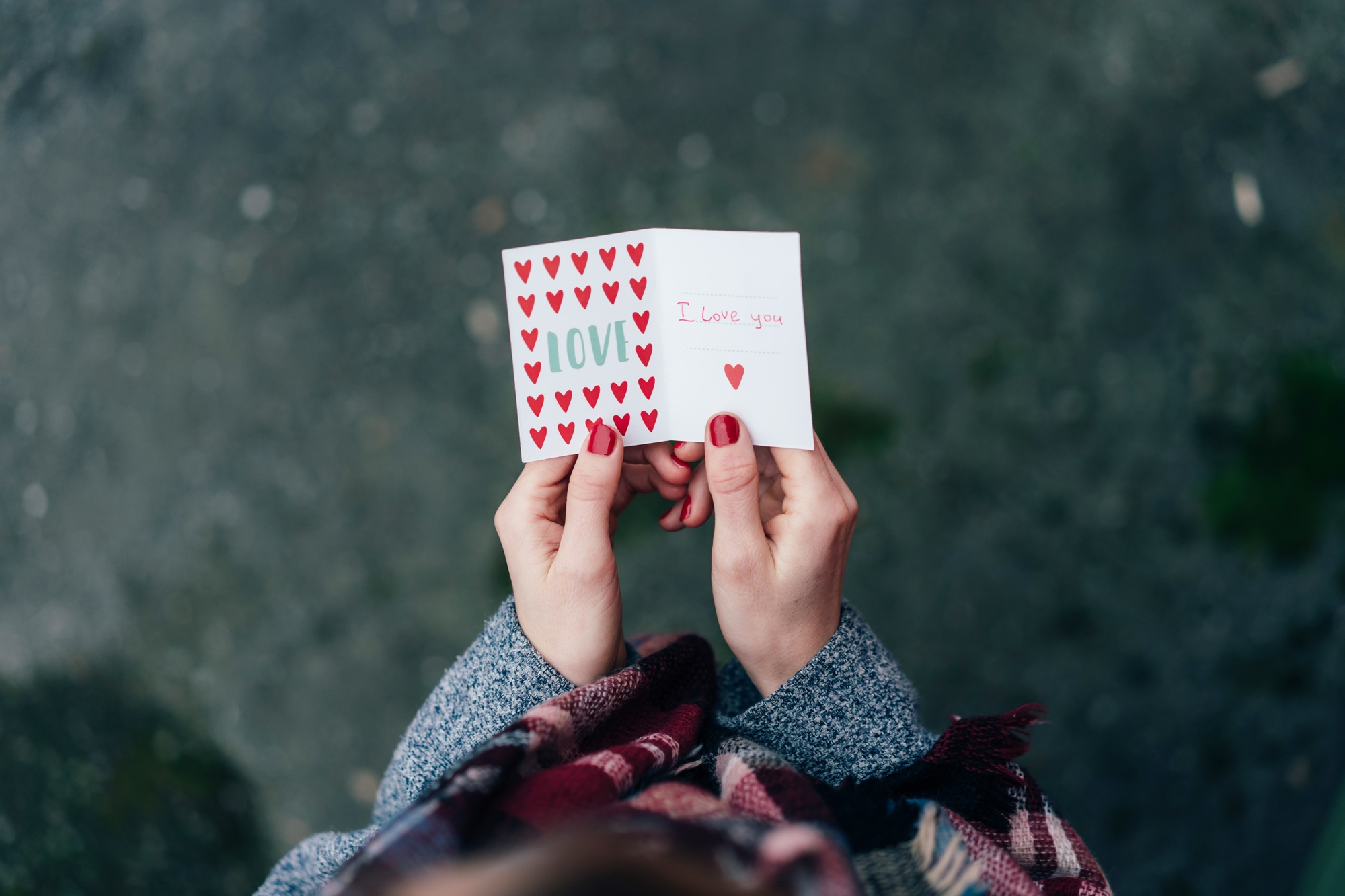 Valentine postcard in female hands. Declaration of love. Valentine's Day
