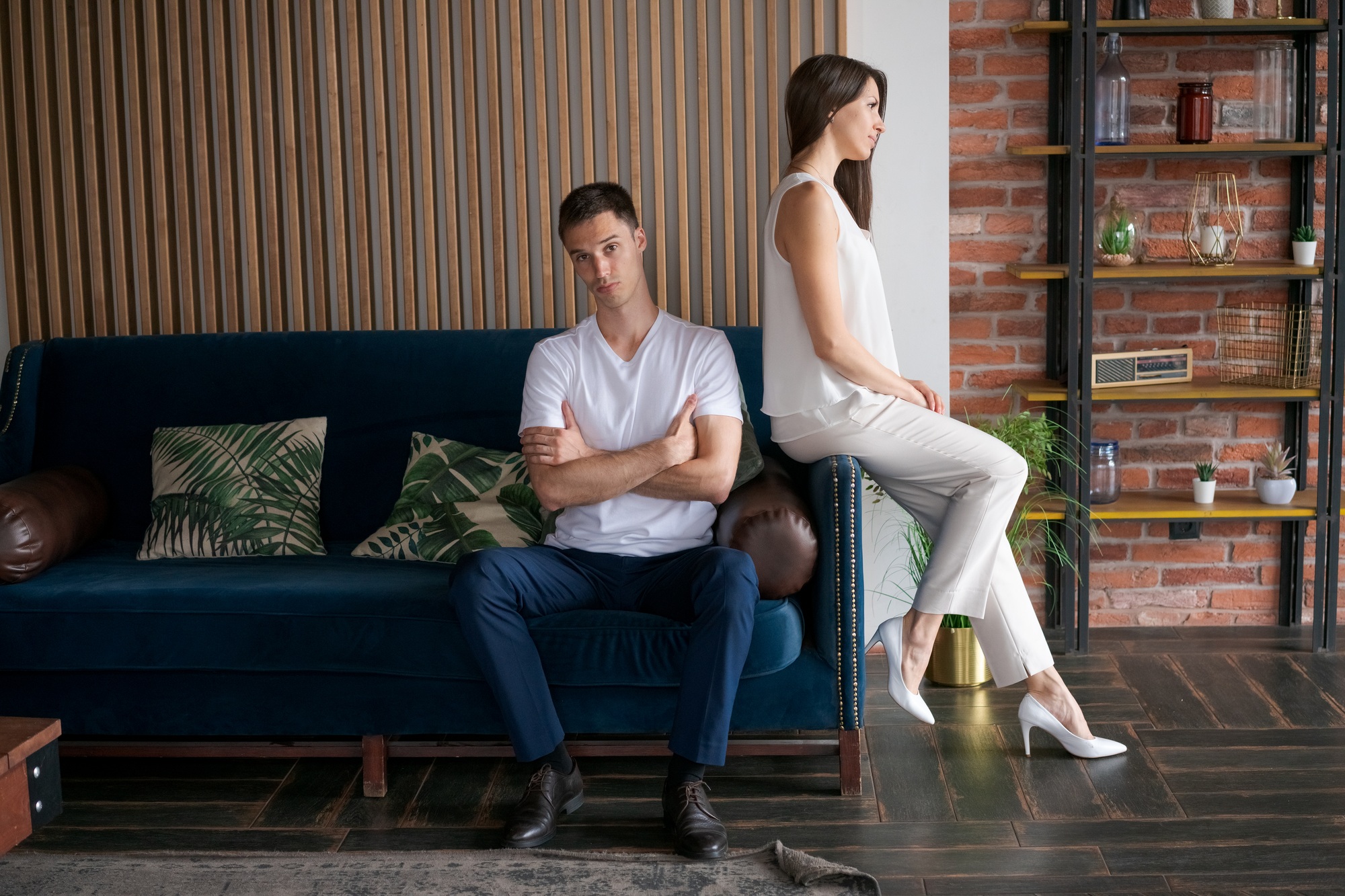 Unhappy couple quarreling at home. Divorce concept. Man and woman turned away